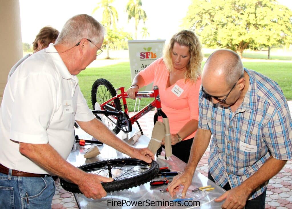 Building bikes is a perfect Corporate Holiday party activity. Fire Power Seminars